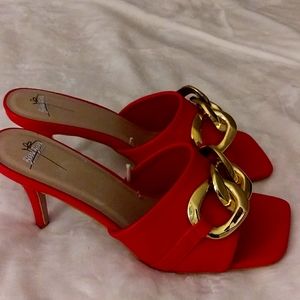 Heeled sandals size 11, red in color.